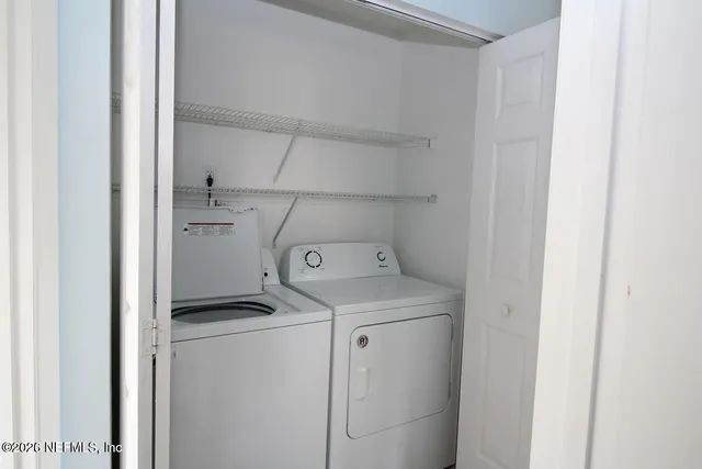 a utility room with dryer and washer
