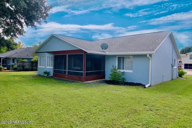 a view of a house with a garden