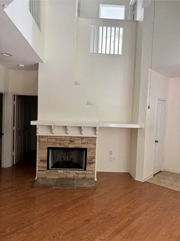 a room with a fireplace and a fireplace
