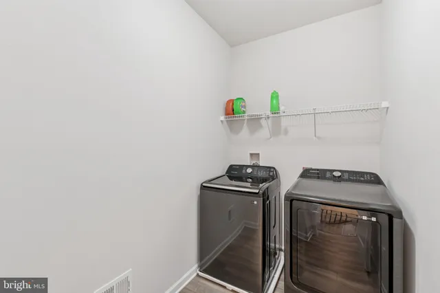 a bedroom with a large bed and a couch