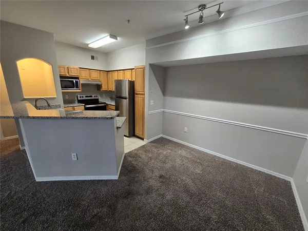 a view of a kitchen with a sink