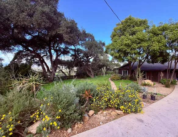 a backyard of a house with lots of green space