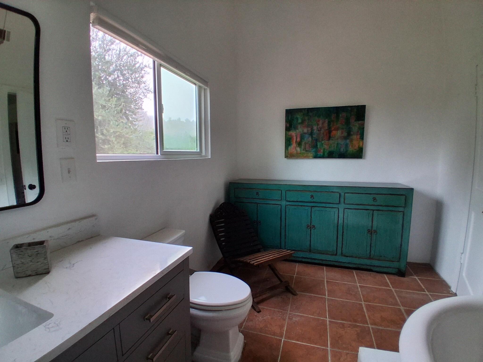 1794 South Rice Road Ojai, CA 93023 - Photo 13 of 33 a bathroom with a toilet a sink and window