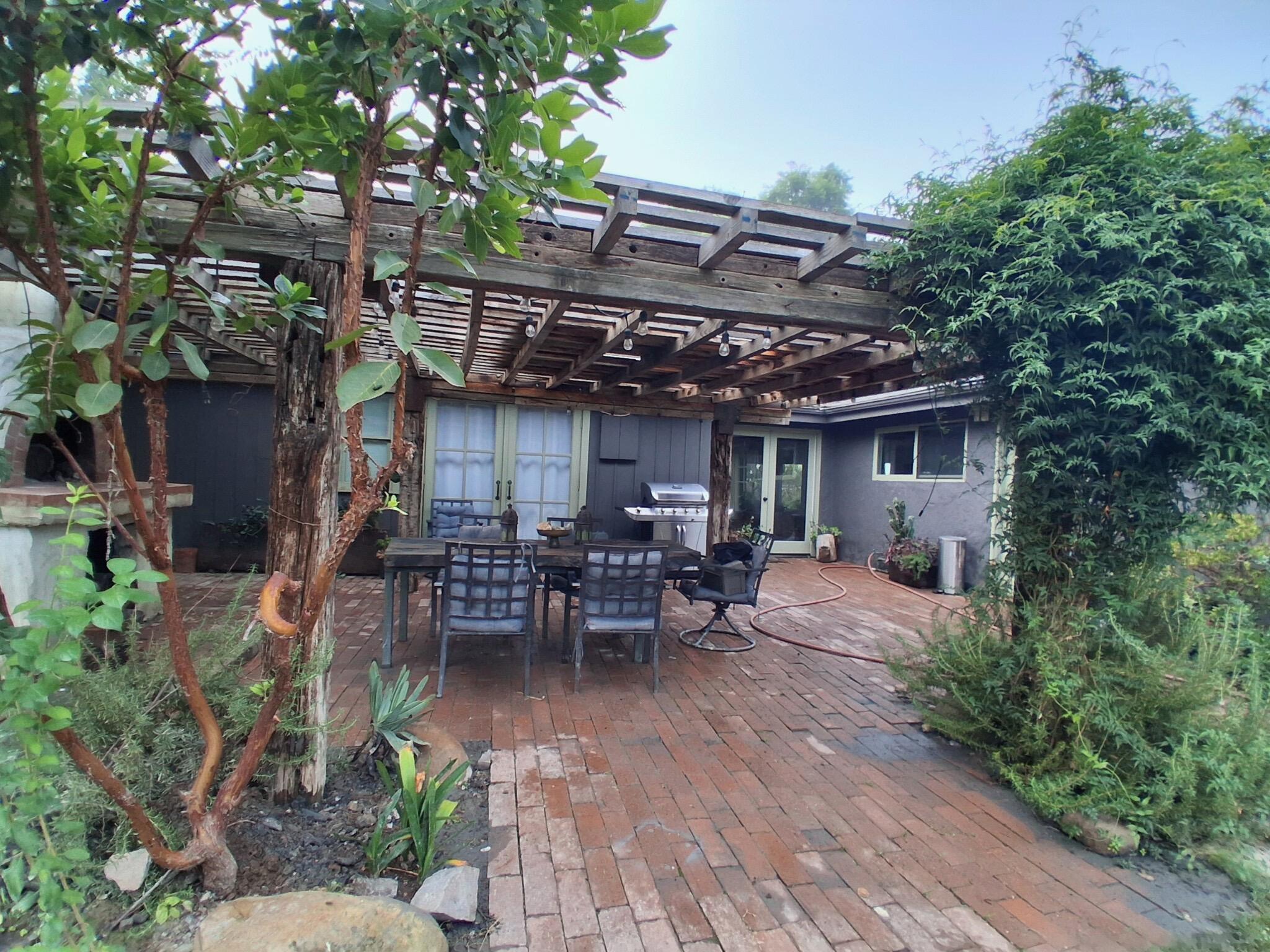 1794 South Rice Road Ojai, CA 93023 - Photo 16 of 33 a view of a patio with table and chairs and potted plants