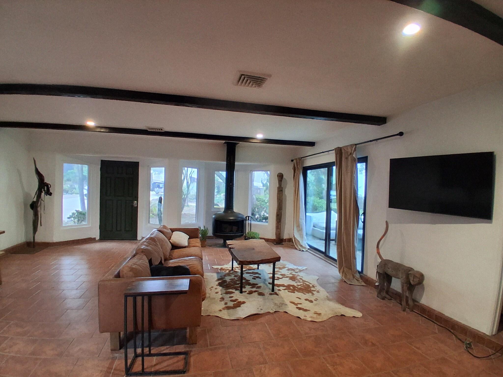1794 South Rice Road Ojai, CA 93023 - Photo 2 of 33 a living room with furniture and a flat screen tv