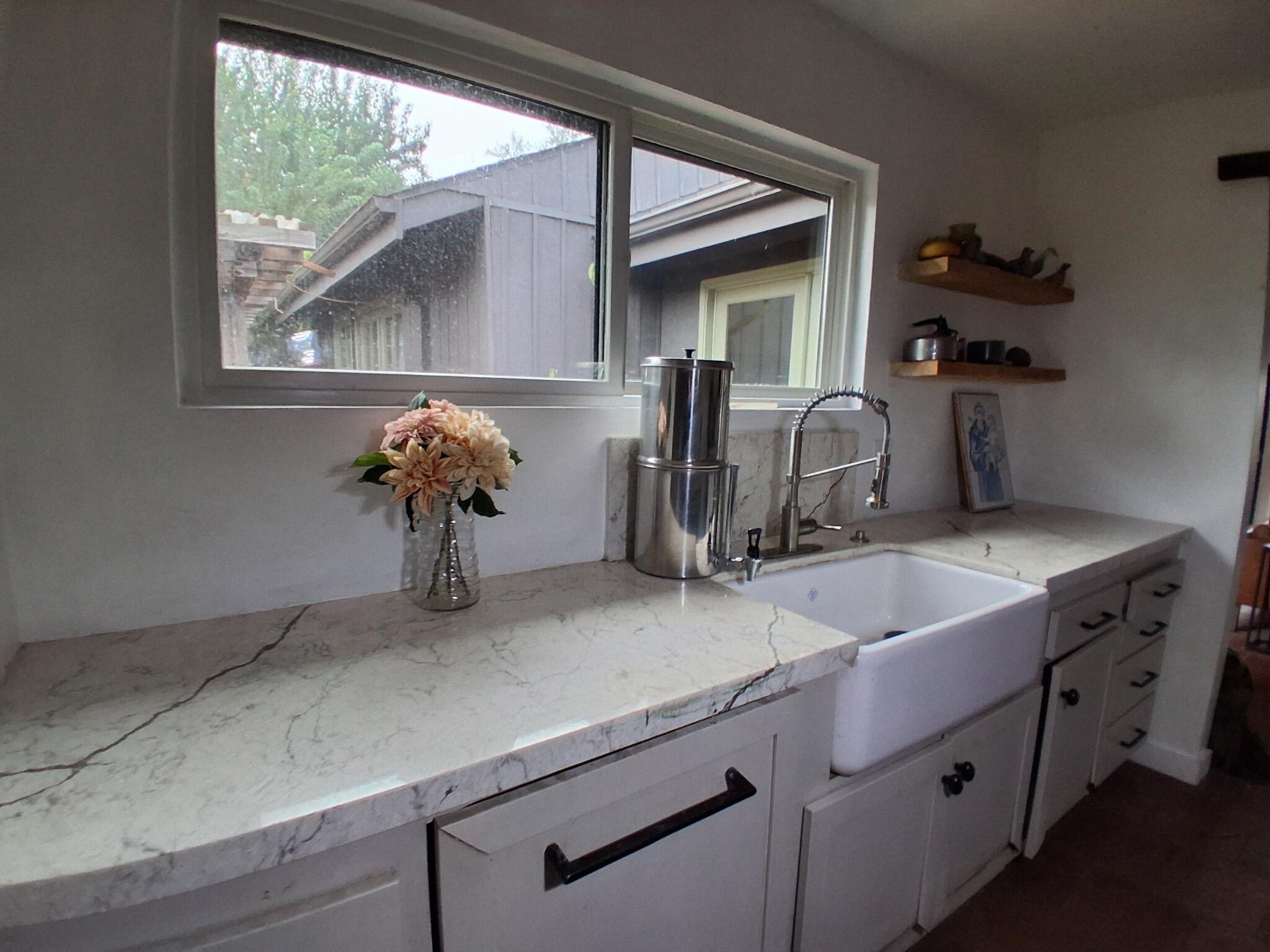 1794 South Rice Road Ojai, CA 93023 - Photo 7 of 33 a kitchen with a sink and a potted plant