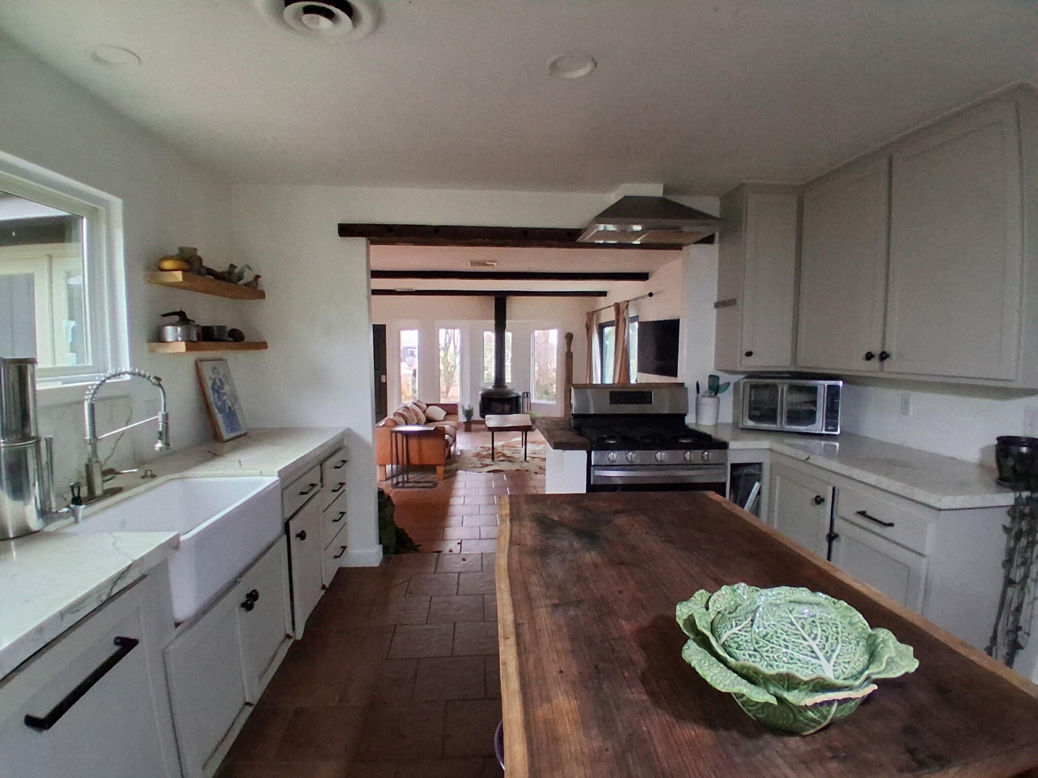 1794 South Rice Road Ojai, CA 93023 - Photo 8 of 33 a kitchen with sink refrigerator and stove