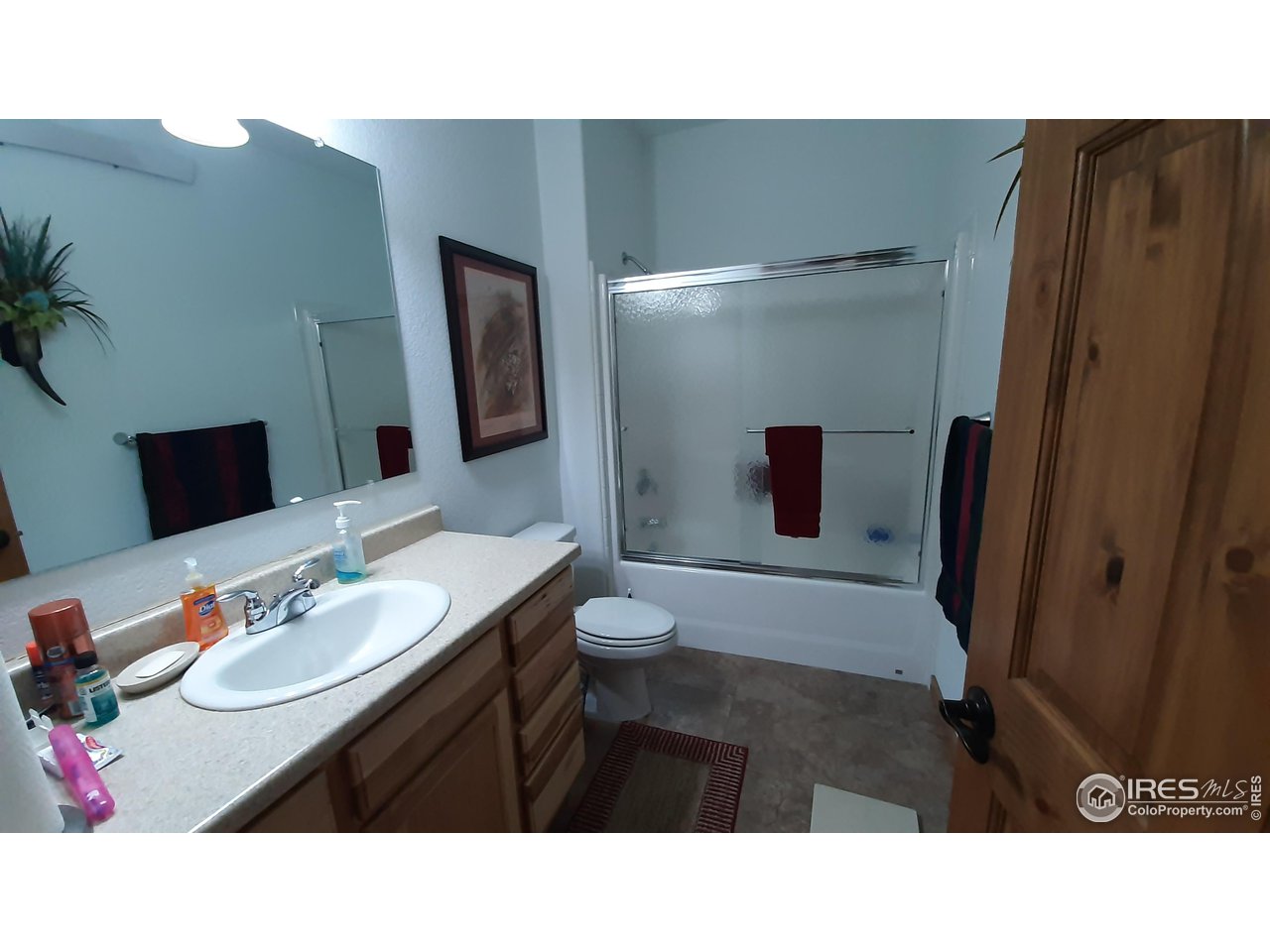 2865 Davis Ranch Road Bellvue, CO 80512 - Photo 16 of 38 a bathroom with a sink vanity granite and a toilet