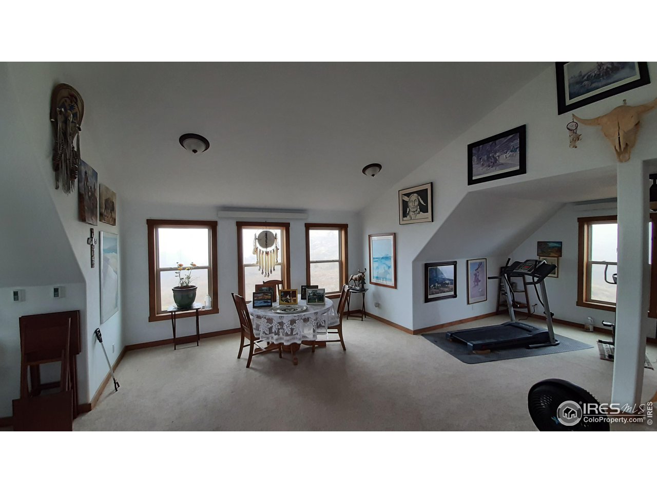 2865 Davis Ranch Road Bellvue, CO 80512 - Photo 22 of 38 a living room with furniture and a flat screen tv