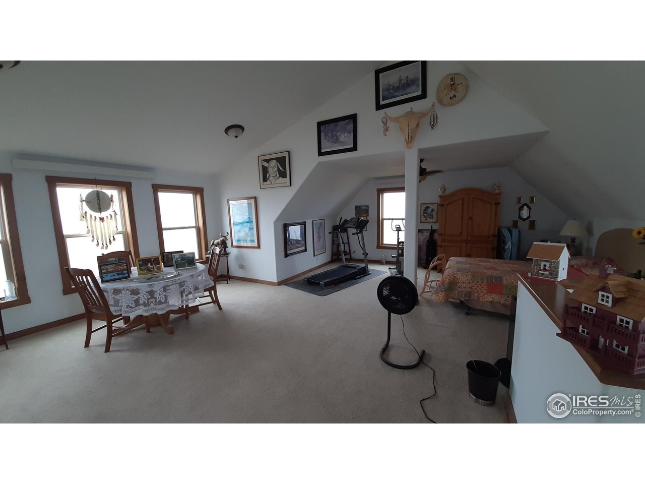 2865 Davis Ranch Road Bellvue, CO 80512 - Photo 23 of 38 a living room with furniture and a mirror