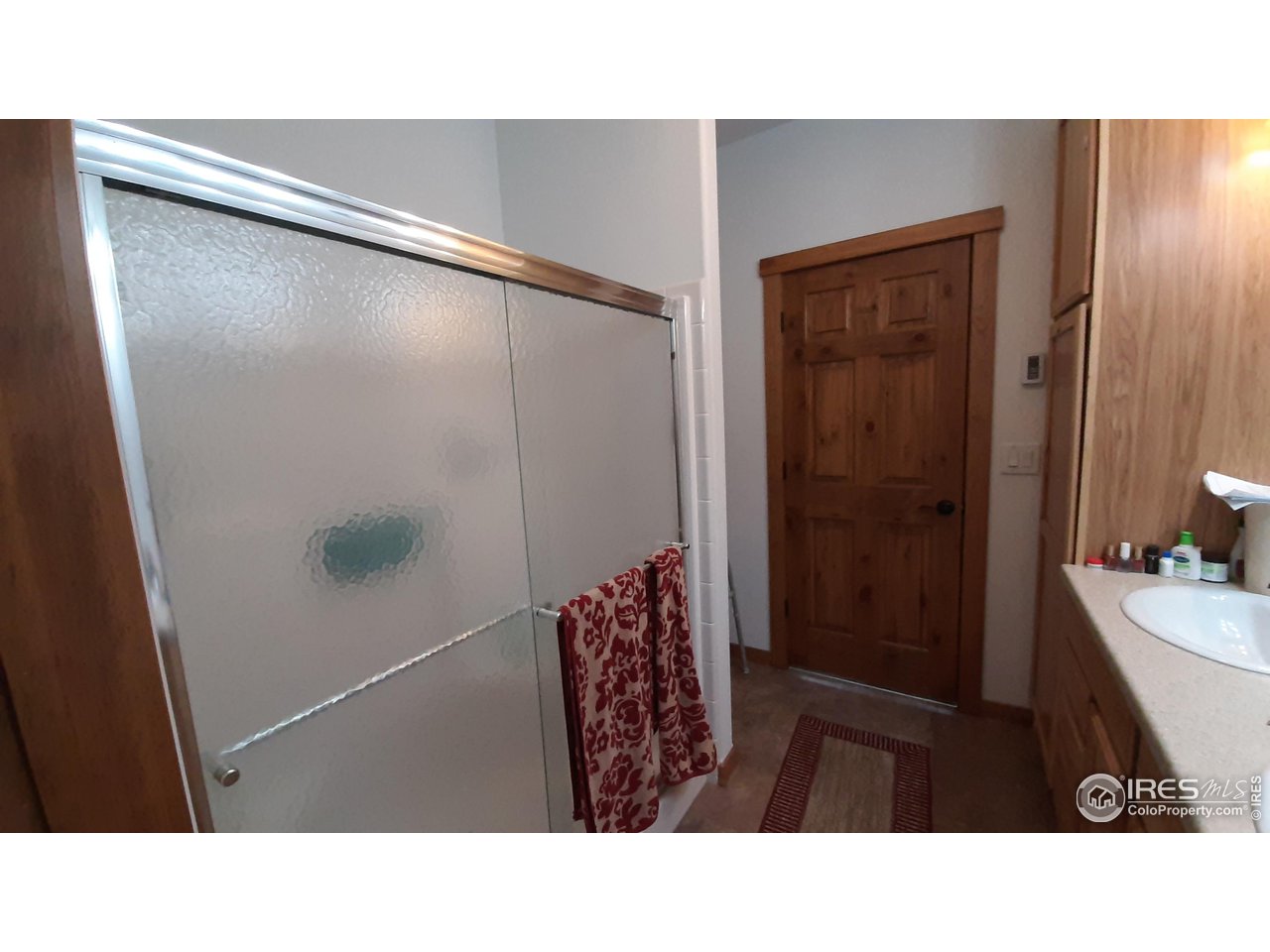 2865 Davis Ranch Road Bellvue, CO 80512 - Photo 28 of 38 a bathroom with a sink and a mirror