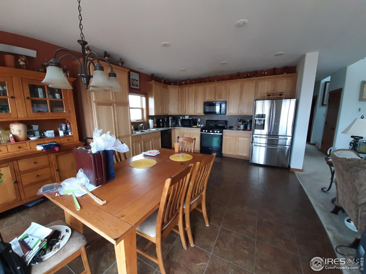 2865 Davis Ranch Road Bellvue, CO 80512 - Photo 7 of 38 a large kitchen with a table and chairs