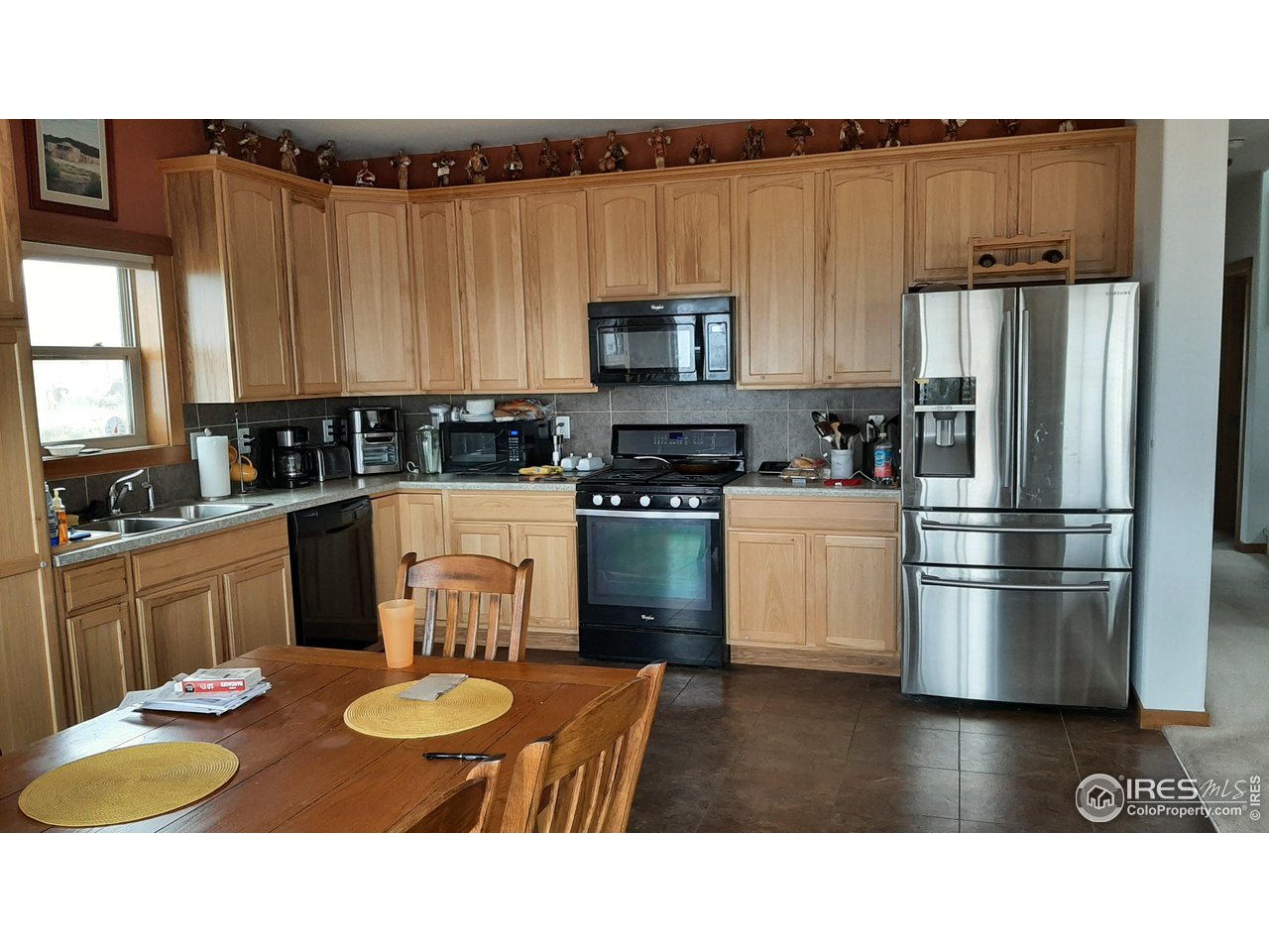 2865 Davis Ranch Road Bellvue, CO 80512 - Photo 8 of 38 a kitchen with a sink appliances and cabinets