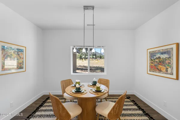 a view of a dining room with furniture window and wooden floor