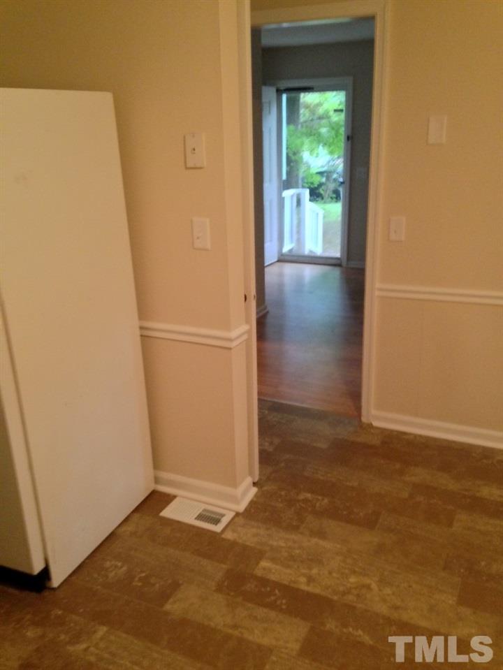 1108 Terrace Court Raleigh, NC 27615 - Photo 3 of 24 an empty room with wooden floor and windows