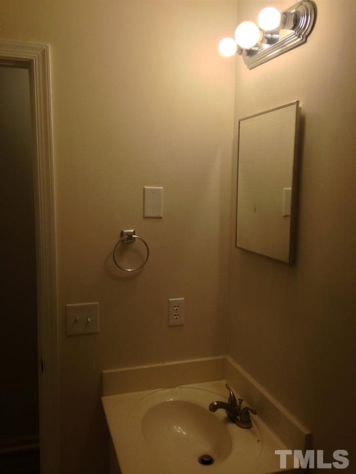 1108 Terrace Court Raleigh, NC 27615 - Photo 22 of 24 a bathroom with a tub and sink