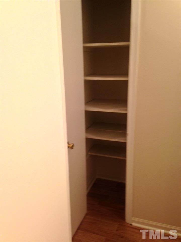 1108 Terrace Court Raleigh, NC 27615 - Photo 7 of 24 a view of walk in closet with empty racks