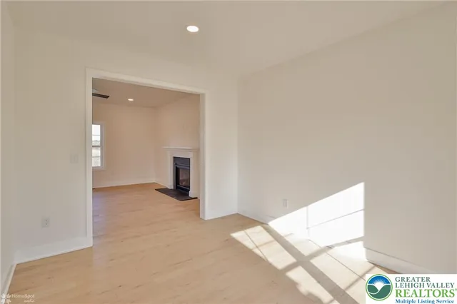 a view of an empty room with a window