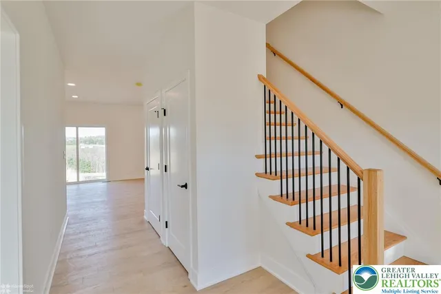 a view of a hallway with staircase