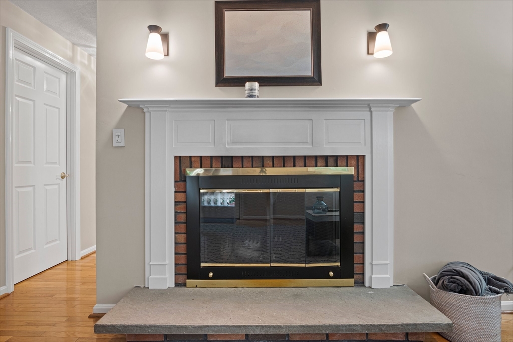 20 Casey Circle, Unit 20 Waltham, MA 02451 - Photo 11 of 38 a living room with a fireplace