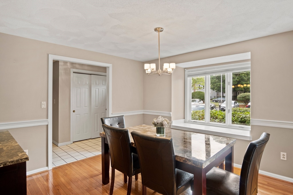 20 Casey Circle, Unit 20 Waltham, MA 02451 - Photo 13 of 38 a view of a dining room with furniture window and wooden floor