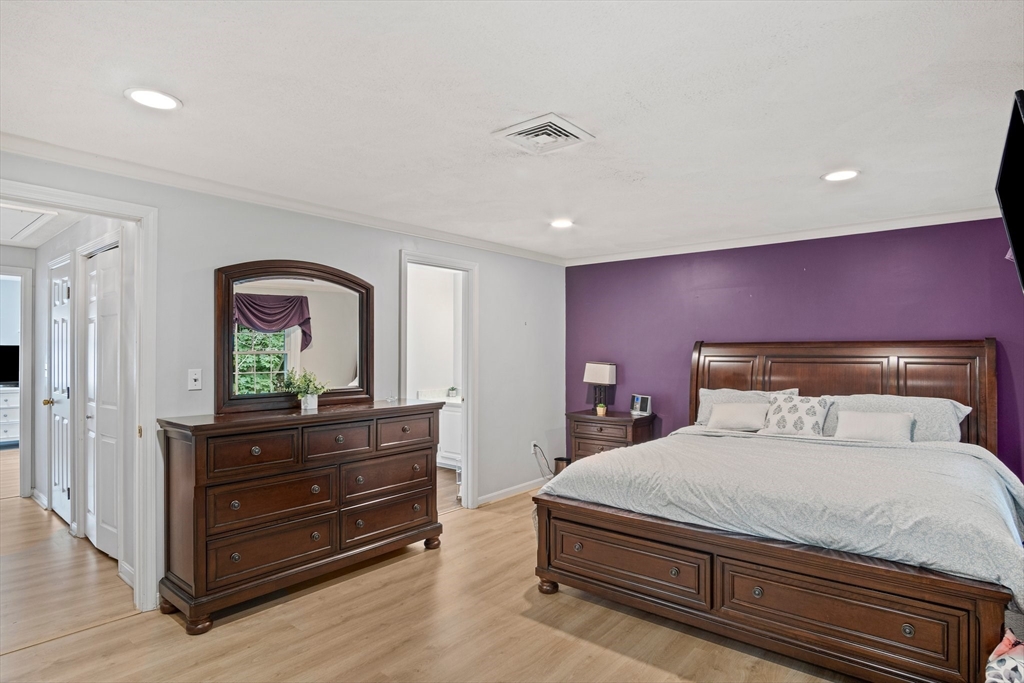 20 Casey Circle, Unit 20 Waltham, MA 02451 - Photo 16 of 38 a bedroom with a bed and a dresser