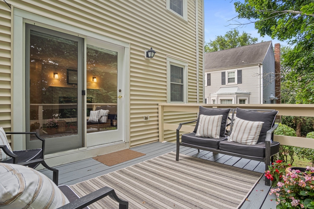 20 Casey Circle, Unit 20 Waltham, MA 02451 - Photo 27 of 38 a view of a patio with a bench
