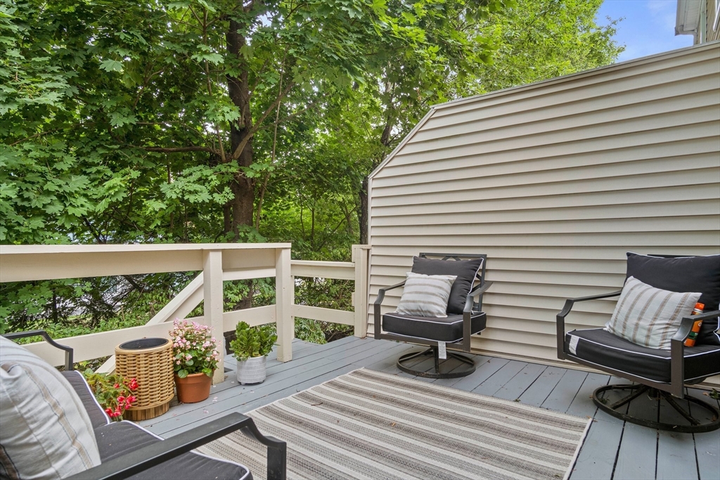 20 Casey Circle, Unit 20 Waltham, MA 02451 - Photo 28 of 38 a view of balcony with wooden floor and outdoor seating