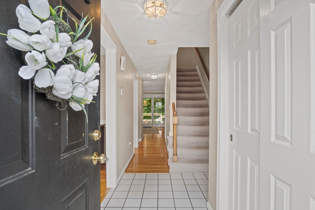 20 Casey Circle, Unit 20 Waltham, MA 02451 - Photo 4 of 38 a view of a hallway with chandelier