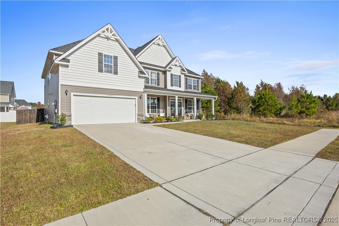 1709 Eagle Hill Road Fayetteville, NC 28312 - Photo 2 of 46 a front view of a house with a yard
