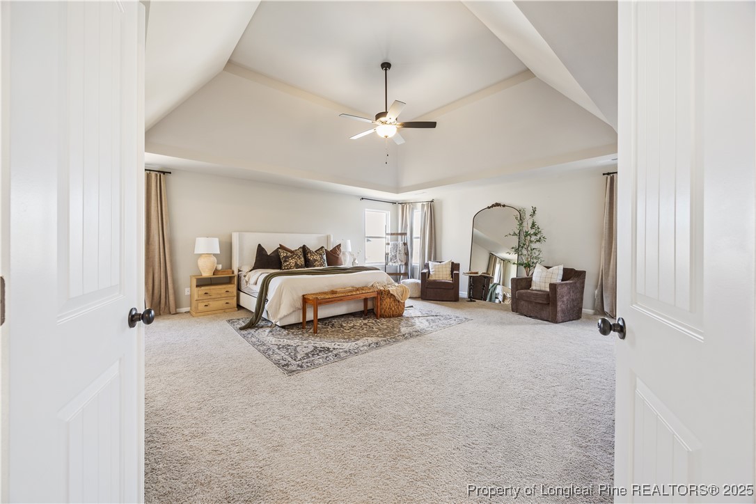 1709 Eagle Hill Road Fayetteville, NC 28312 - Photo 28 of 46 a bedroom with bed and a chandelier