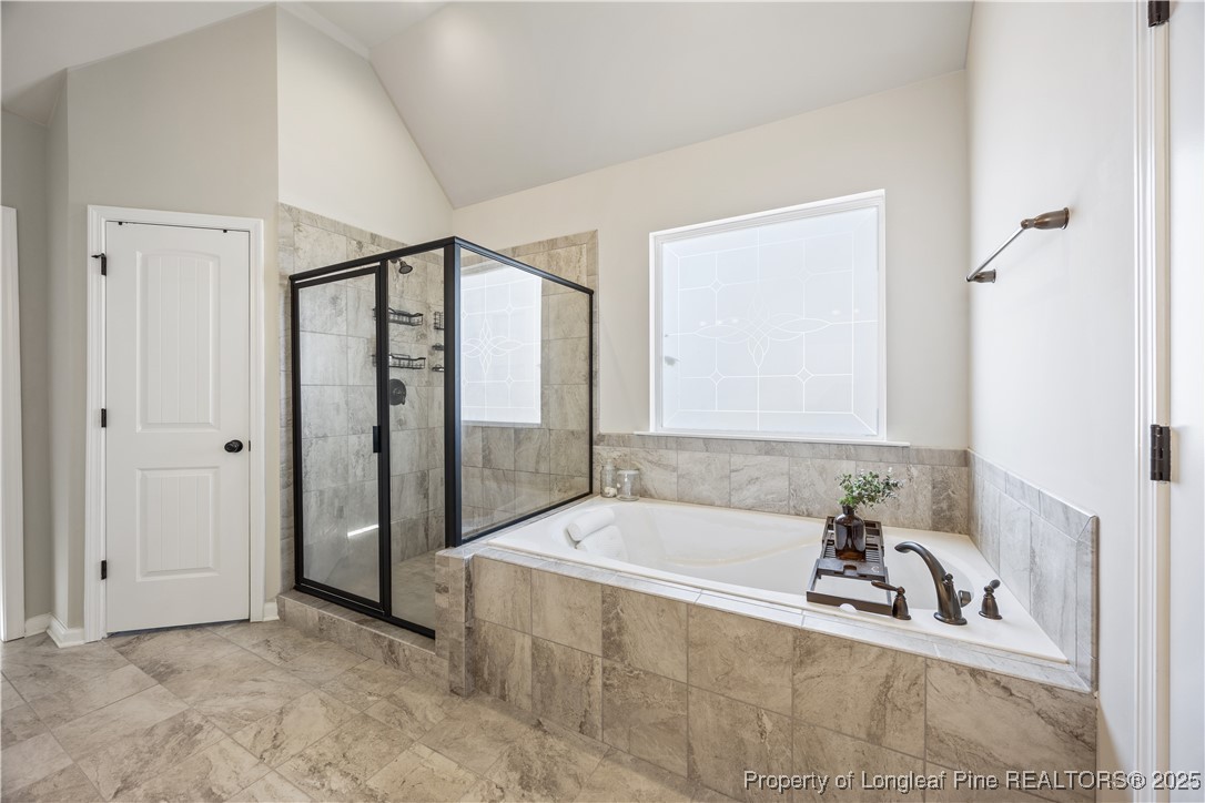 1709 Eagle Hill Road Fayetteville, NC 28312 - Photo 34 of 46 a spacious bathroom with a tub and shower