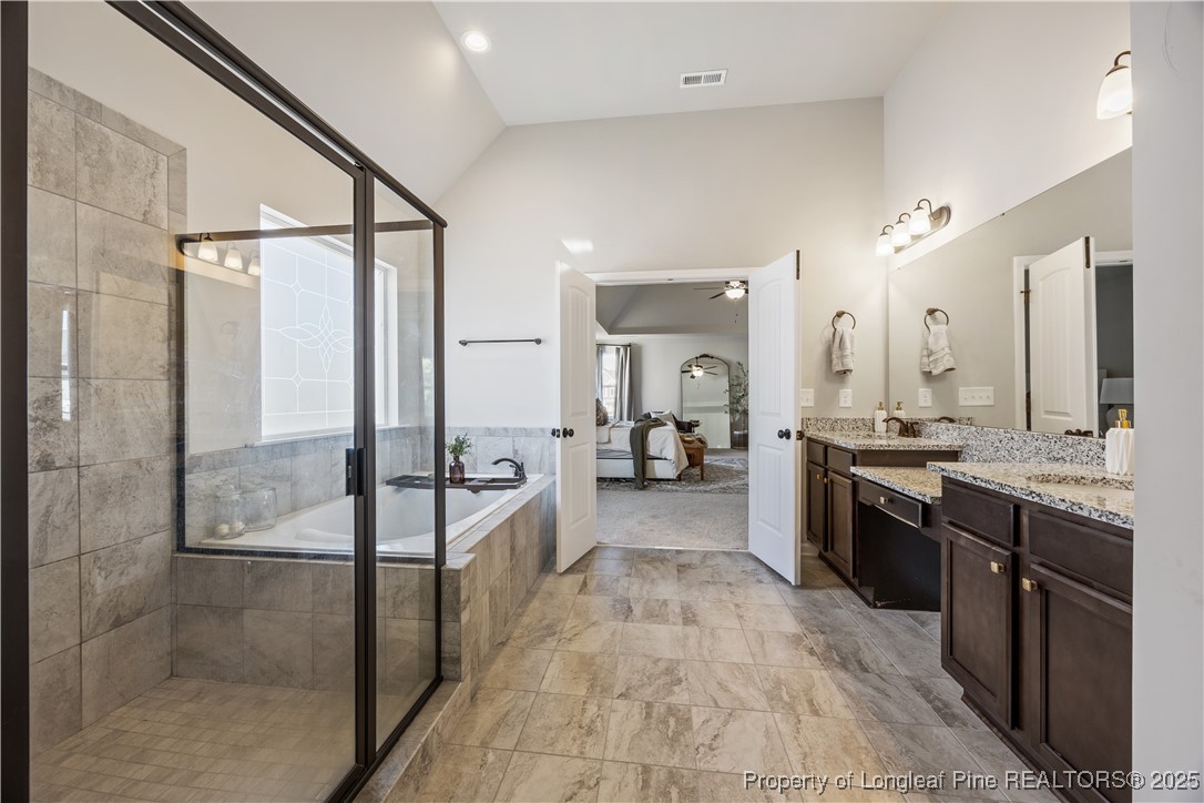 1709 Eagle Hill Road Fayetteville, NC 28312 - Photo 35 of 46 a large bathroom with a glass shower door and a sink