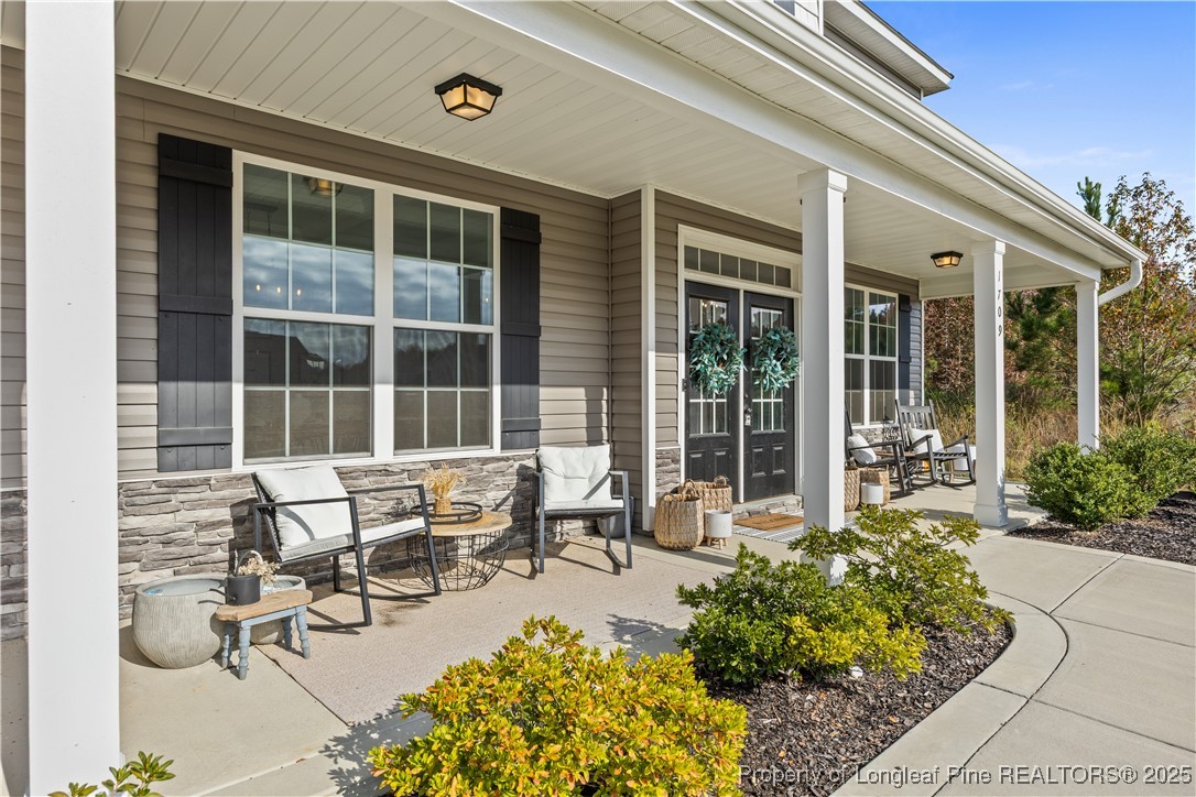 1709 Eagle Hill Road Fayetteville, NC 28312 - Photo 4 of 46 a building outdoor space with patio furniture and potted plants