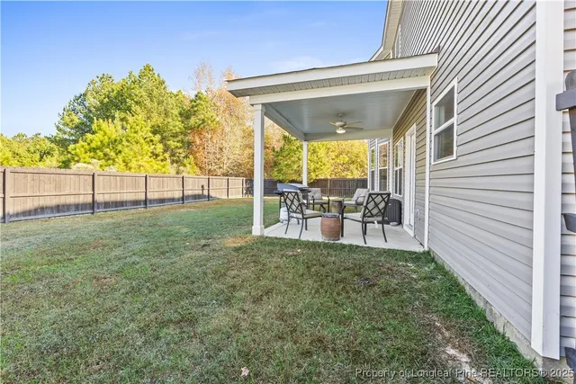 a view of backyard with trampoline