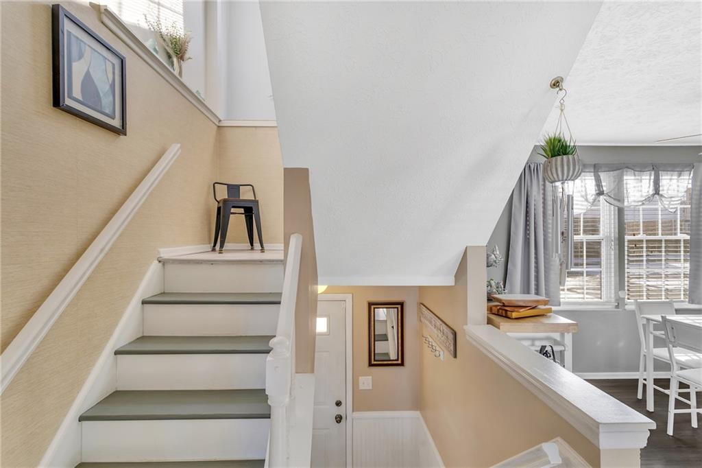4 B Springwood Square Harwick, PA 15049 - Photo 15 of 32 a view of staircase with white walls and a window