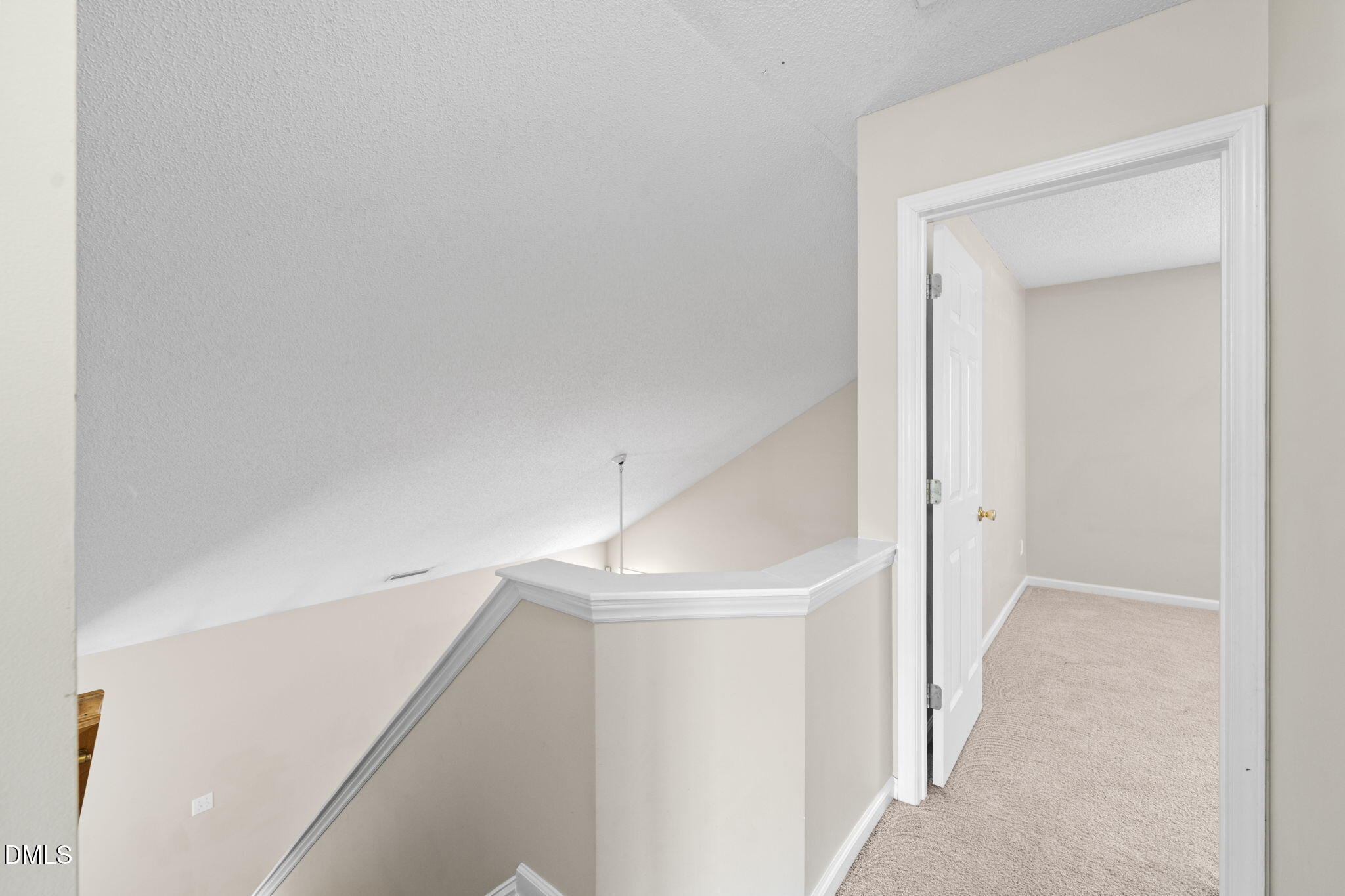 4701 Tommans Trail Raleigh, NC 27616 - Photo 19 of 36 a view of a hallway with staircase