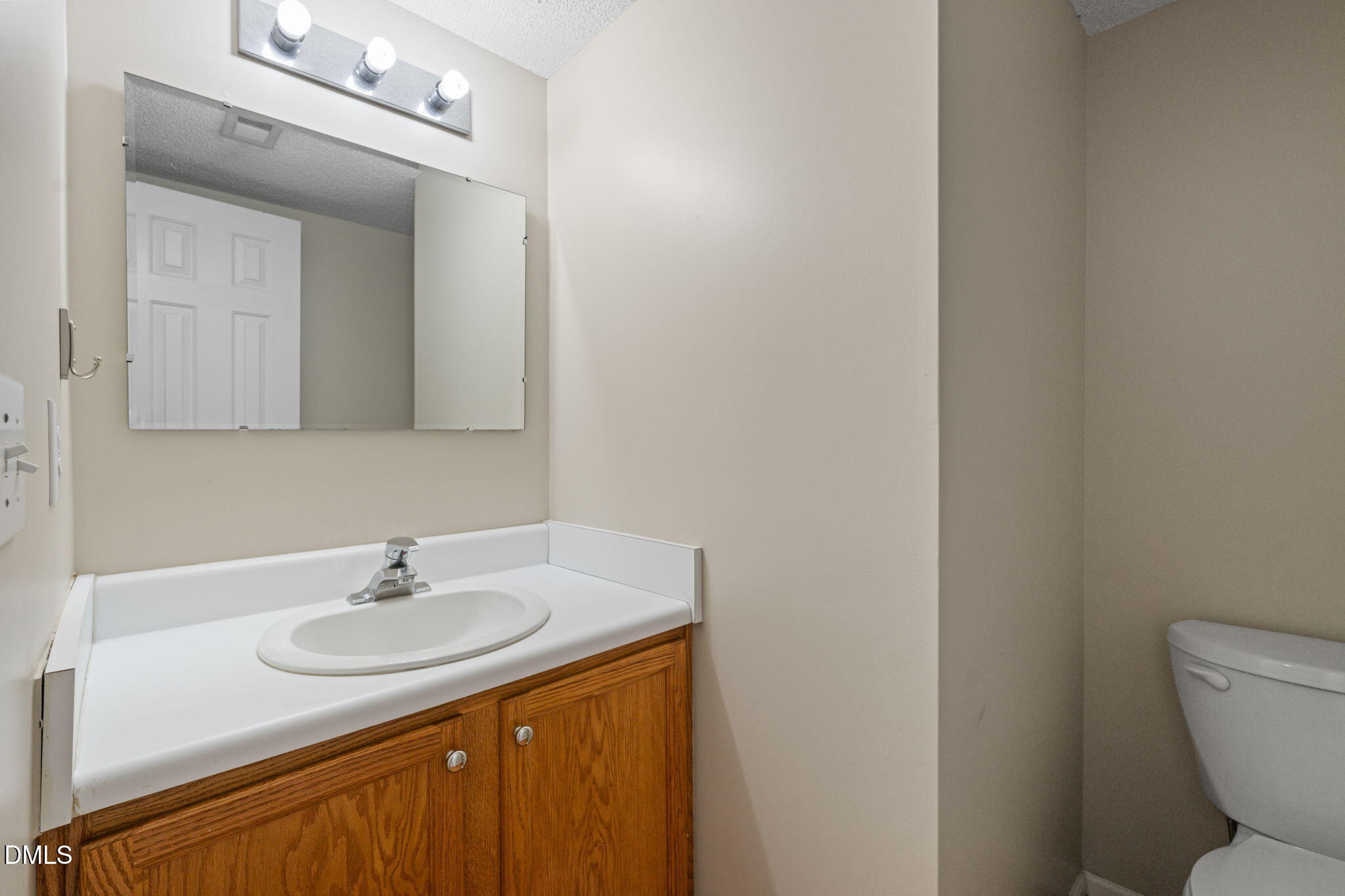 4701 Tommans Trail Raleigh, NC 27616 - Photo 20 of 36 a bathroom with a sink and a toilet