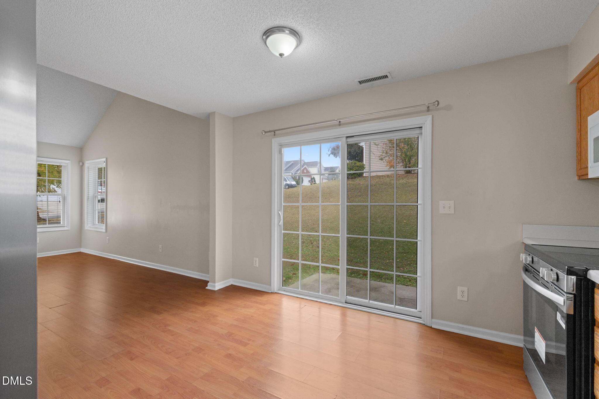 4701 Tommans Trail Raleigh, NC 27616 - Photo 22 of 36 an empty room with wooden floor and windows