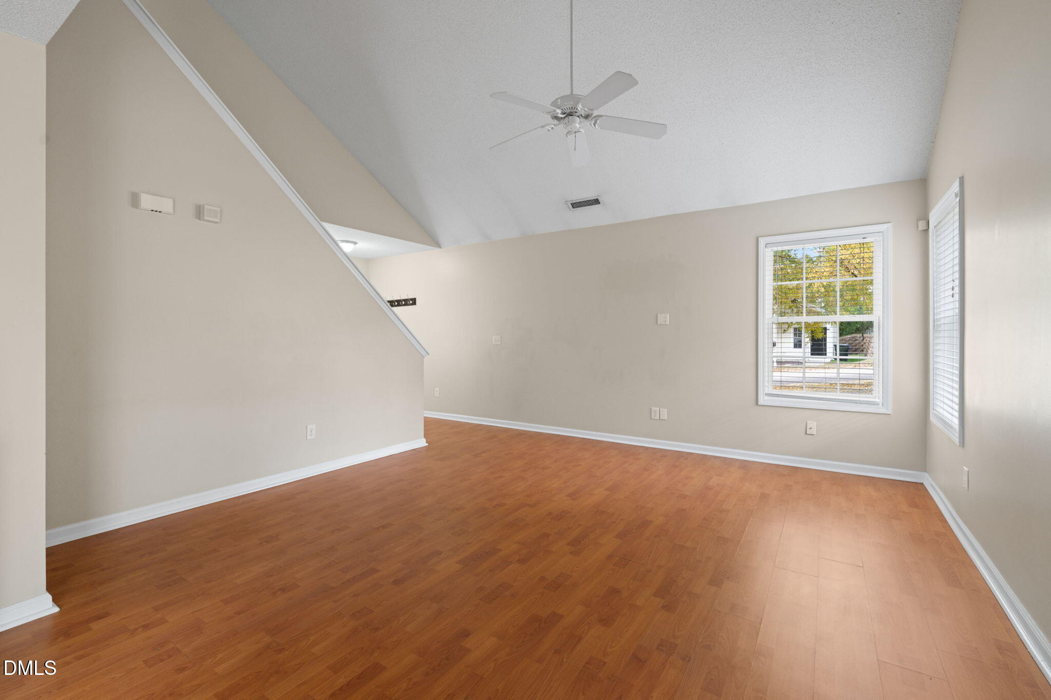 4701 Tommans Trail Raleigh, NC 27616 - Photo 28 of 36 wooden floor in an empty room with a window