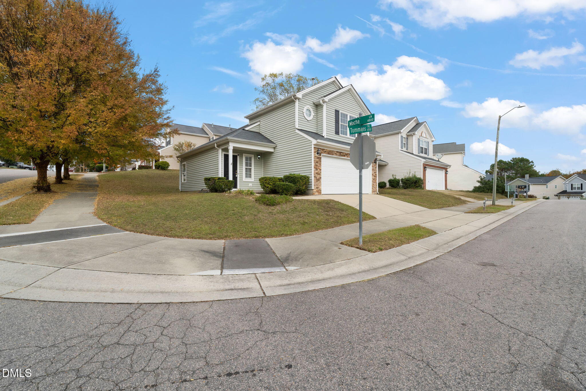 4701 Tommans Trail Raleigh, NC 27616 - Photo 3 of 36 a front view of a house with a yard and garage
