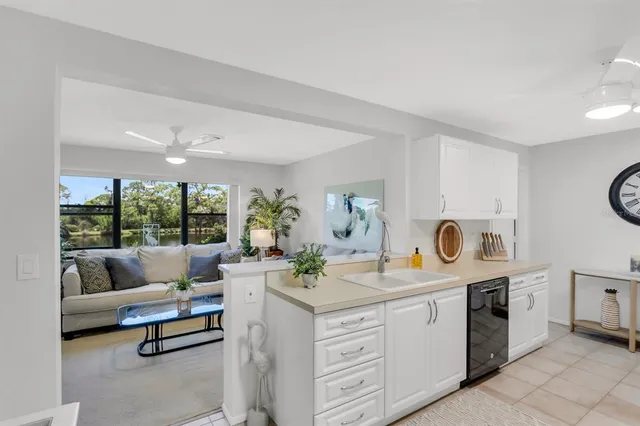 a view of a lake with houses in the background