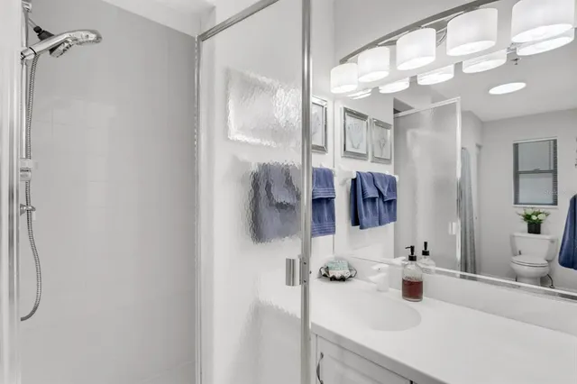 swimming pool view with a seating space