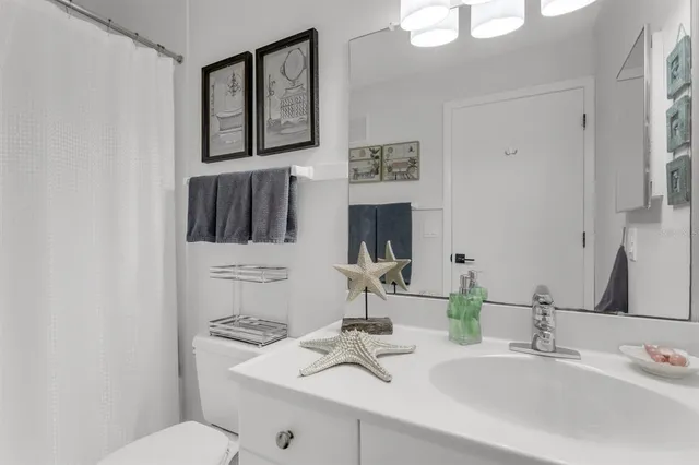 a view of a chairs and table in the balcony