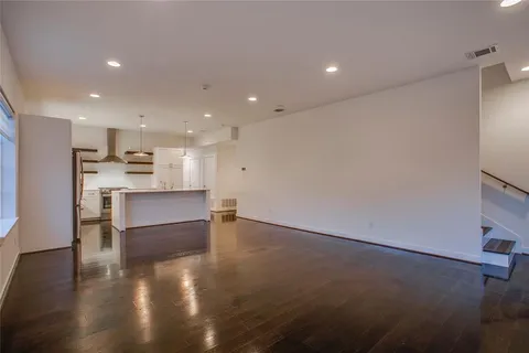 a view of kitchen with kitchen island and stainless steel appliances