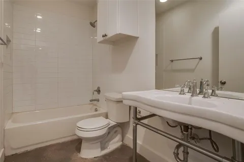 a bathroom with a sink a toilet and a bathtub