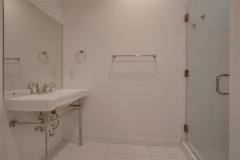 a bathroom with a sink and mirror
