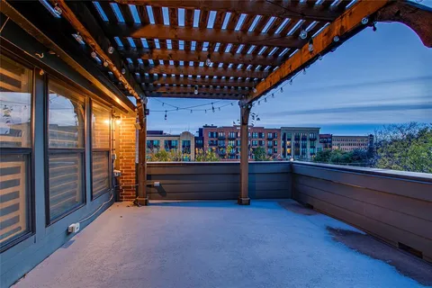 a balcony with lots of green space and plants
