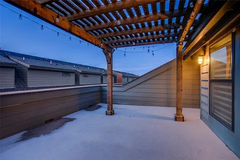 a view of a water with palm trees