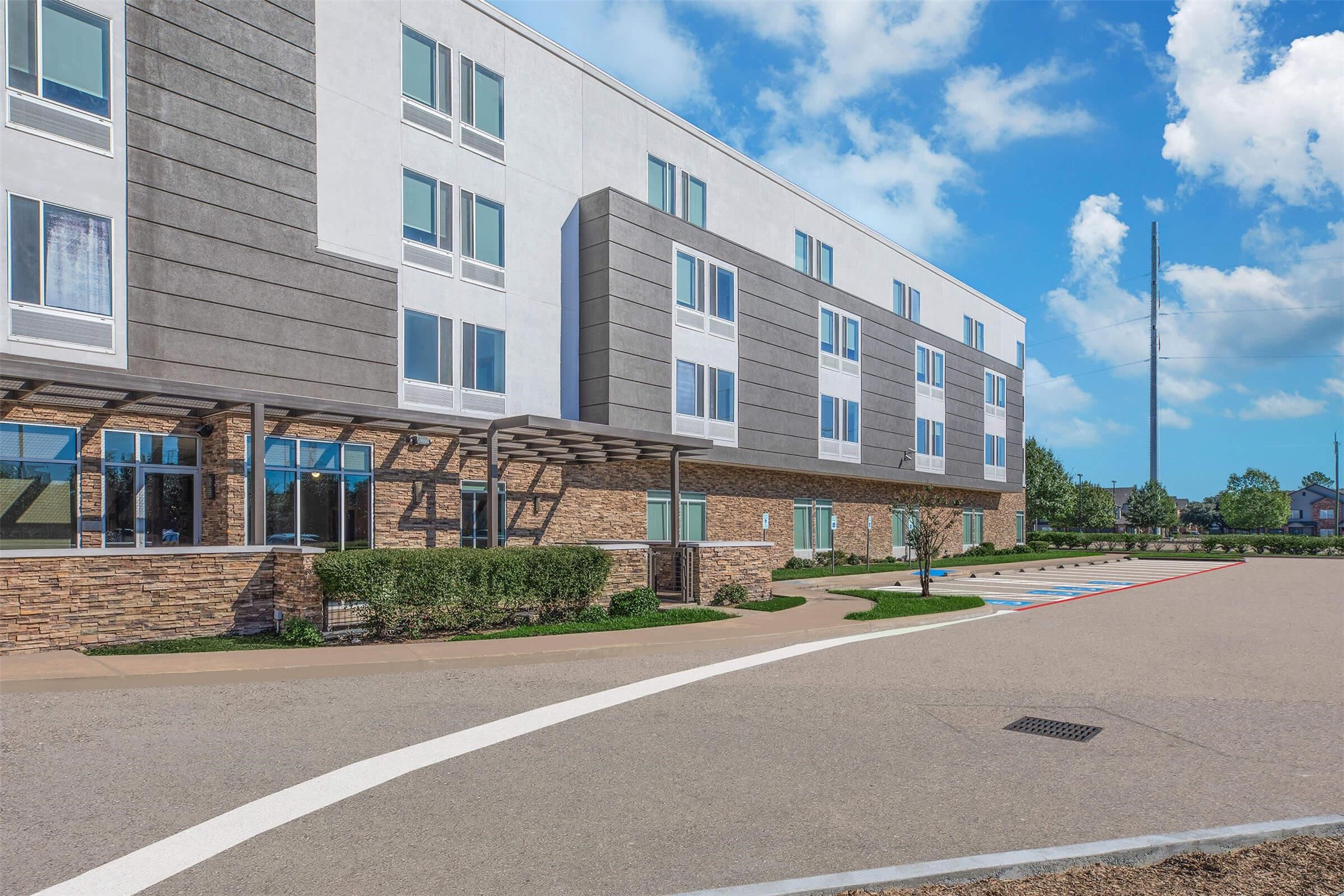 1350 Broadfield Boulevard, Unit 228 Houston, TX 77084 - Photo 14 of 29 a city street lined with tall buildings and a street